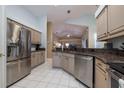 Kitchen features stainless steel appliances and granite countertops at 3623 Doral St, Palm Harbor, FL 34685