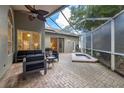 Relaxing screened patio with built-in spa and seating area at 3623 Doral St, Palm Harbor, FL 34685