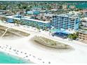 Aerial view of beachfront hotel with pool and beach access at 10650 Gulf Blvd # 340, Treasure Island, FL 33706