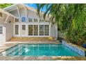 Private backyard pool surrounded by lush landscaping, creating a serene oasis at 106 19Th Ave, St Pete Beach, FL 33706