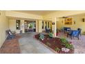 Inviting condo lobby with seating area and landscaped courtyard at 5775 Park N St # 411, St Petersburg, FL 33709