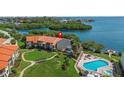 Aerial view of condo building near waterfront amenities at 1515 Pinellas Bayway S # 65, St Petersburg, FL 33715