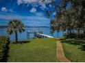 Private backyard oasis with a dock and access to the water at 311 Sunset N Dr, St Petersburg, FL 33710