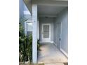 House entrance with covered porch at 62 Emerald Bay Dr, Oldsmar, FL 34677