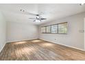 Spacious living room featuring hardwood floors and neutral walls at 1618 Valencia St, Clearwater, FL 33756