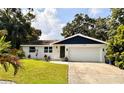 Beautiful single-story home with a well-kept lawn and a two-car garage, perfect for curb appeal at 1503 Edna Ave Nw, Largo, FL 33770