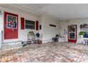 Covered patio with brick pavers, and two entrances at 192 Blue Marlin Dr, Oldsmar, FL 34677