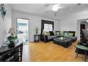 Comfortable living room featuring a large sofa and bright, airy ambiance at 7787 39Th N Ter # 7787, St Petersburg, FL 33709