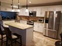 Modern kitchen with granite island and stainless steel appliances at 154 St Ives Dr, Palm Harbor, FL 34684