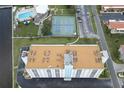 Aerial view showing building, tennis courts, and surrounding area at 10216 Regal Dr # 708, Largo, FL 33774
