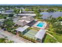 Community features pool, shuffleboard, and clubhouse near lake at 4411 Rustic Dr # 4411, New Port Richey, FL 34652