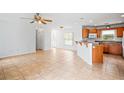 Spacious, open-concept living room with ceramic tile flooring and open flow to the kitchen at 1740 51St N St, St Petersburg, FL 33710