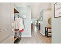Bright entryway with wood-look floors and coat rack at 5228 New Friendship Pl, Tampa, FL 33619