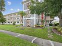 Condo building showcasing entrance and landscaping at 6015 19Th N St # 117, St Petersburg, FL 33714