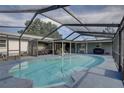 Relaxing screened-in pool area with plenty of space for entertaining at 7809 Alafia Dr, Riverview, FL 33578