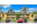Well maintained, two-story building with palm trees, golf carts, and convenient parking at 6816 Dali Ave # 101, Land O Lakes, FL 34637