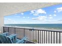 Stunning ocean view from balcony with chairs at 14300 Gulf Blvd # 206, Madeira Beach, FL 33708