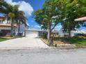 Single-Gathering home with a two-car garage and landscaped yard at 3912 Fontainebleau Dr, Tampa, FL 33634