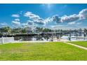 Waterfront backyard with private dock and lush grass at 6240 Bayside Dr, New Port Richey, FL 34652