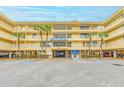 Condo building exterior with parking and welcome center at 2506 N Rocky Point Dr # 274, Tampa, FL 33607