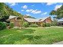 Beautiful single-story house with lush landscaping at 3045 Kevlyn Ct, Safety Harbor, FL 34695
