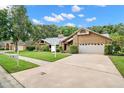 Spacious house with a large driveway and yard at 3045 Kevlyn Ct, Safety Harbor, FL 34695