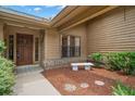 Inviting entryway with a charming stone bench at 3045 Kevlyn Ct, Safety Harbor, FL 34695
