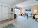 Inviting living room features plush carpeting, neutral walls, and ample natural light at 7839 39Th N Ter, St Petersburg, FL 33709