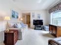 Cozy living room with plush carpet, comfortable seating and natural light at 7839 39Th N Ter, St Petersburg, FL 33709