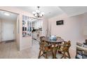 Small dining area with a round table and kitchen view at 165 114Th N Ave # 165, St Petersburg, FL 33716