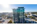 Stunning exterior of a modern high-rise building featuring glass windows, balconies, and a sleek architectural design at 777 3Rd N Ave # 1401, St Petersburg, FL 33701