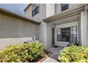 Front porch with a bench, providing a welcoming entrance at 602 Quail Keep Dr, Safety Harbor, FL 34695