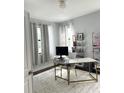 Home office with a large desk, window with curtains, and a plush rug at 1301 22Nd N Ave, St Petersburg, FL 33704