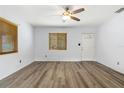 Bright living room with hardwood floors and ceiling fan at 18053 2Nd E St, Redington Shores, FL 33708