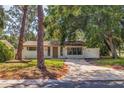 Newly renovated home with a spacious front yard and driveway at 135 Se Monroe N Cir, St Petersburg, FL 33703