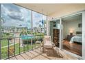 Screened balcony overlooking the community pool and surrounding area at 8693 Bardmoor Blvd # 202B, Seminole, FL 33777