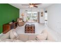 Living room with access to a screened balcony and pool view at 8693 Bardmoor Blvd # 202B, Seminole, FL 33777