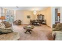Bright dining room with a chandelier, hardwood floors, and a large hutch at 22531 Eagles Watch Dr, Land O Lakes, FL 34639