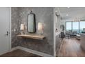 Modern entryway with wood accent wall and floating shelf at 100 1St N Ave # 2501, St Petersburg, FL 33701