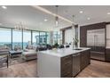 Modern kitchen with island, stainless steel appliances, and hardwood floors at 100 1St N Ave # 2501, St Petersburg, FL 33701