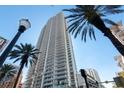 Modern high rise building with palm trees and city street view at 100 1St N Ave # 2501, St Petersburg, FL 33701