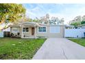 Updated one-story home with covered porch and fenced yard at 219 6Th Sw Ave, Largo, FL 33770