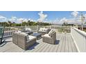 Relaxing rooftop deck with wicker furniture, offering city views at 2200 W Bay Isle Se Dr, St Petersburg, FL 33705