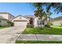 One-story house with a two-car garage and manicured lawn at 448 Stone Briar Dr, Ruskin, FL 33570