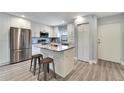 Modern kitchen with stainless steel appliances and island at 7050 Sunset S Dr # 104, South Pasadena, FL 33707