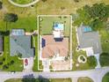 Bird's-eye view of house, pool, and surrounding area at 10177 Sunburst Ct, Spring Hill, FL 34608