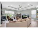 Spacious living room with a fireplace and comfortable seating at 435 Westwinds Drive, Palm Harbor, FL 34683
