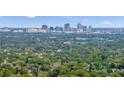 Aerial view of a neighborhood with lush green trees and a city skyline at 650 Pinellas Point S Dr # 106, St Petersburg, FL 33705