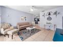 Living room with beige sofa and coffee table at 5534 Atlantic N Ave, St Petersburg, FL 33703