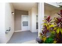Private entryway with exterior door and lush landscaping at 11520 Shipwatch Dr # 1386, Largo, FL 33774